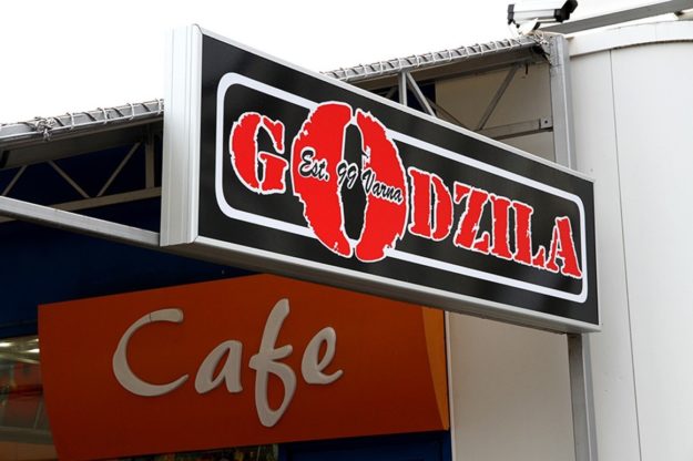 Illuminated signage for Godzila Restaurant