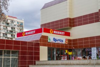 T Market illuminated sign