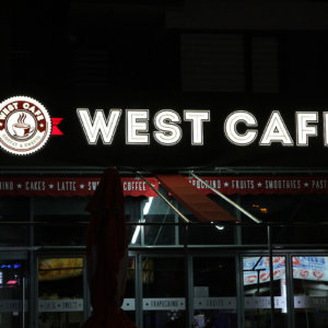 West Cafe -LED channel letters on wooden sign