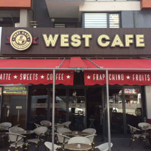 West Cafe -LED channel letters on wooden sign