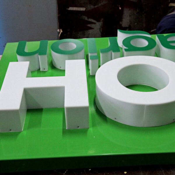 Acrylic channel letters on composite panel sign Acrylic channel letters on composite panel sign