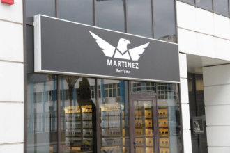 Illuminated sign with the logo of Martinez