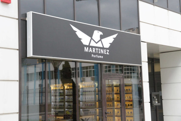 Illuminated sign with the logo of Martinez