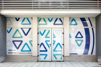 Perforated film installation on glass facade for office