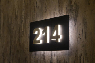 Illuminated room number signs for a hotel