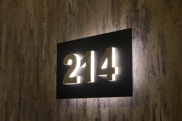 Illuminated room number signs for a hotel