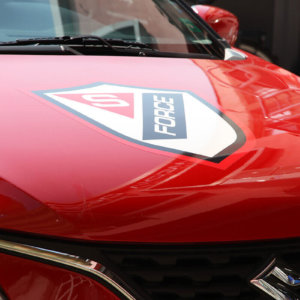 Logo of S Force Security at the front cover of Suzuki Baleno Logo of S Force Security at the front cover of Suzuki Baleno