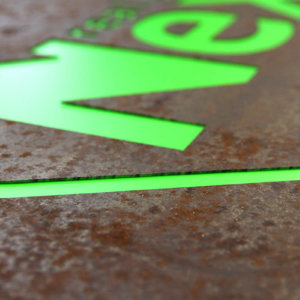 Illuminated metal sign with green plexiglass and embedded letters- NEXT – Brokerage company NEXT sign with green plexiglass and embedded letters