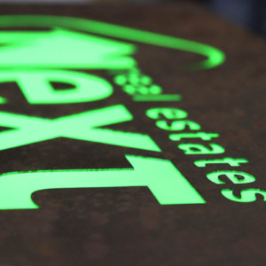 Illuminated metal sign – NEXT – Brokerage & Consulting Services company Illuminated metal sign - NEXT with embedded letters