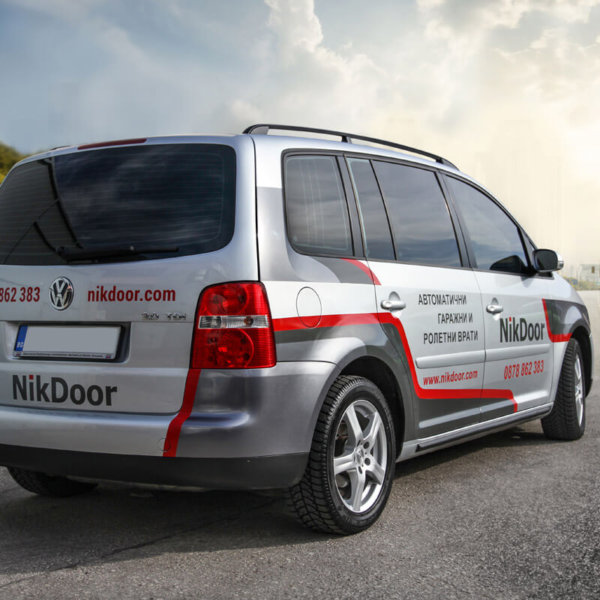 Branding a car with advertising graphics Nikdoor Car wrap with advertising graphics Nikdoor