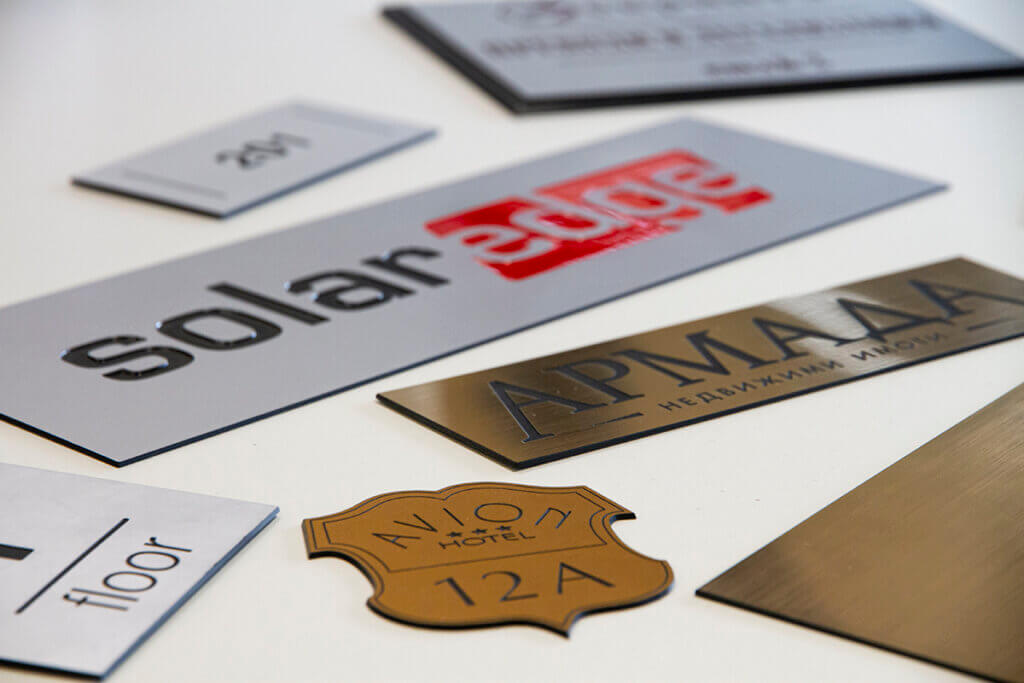 Engraved metal plates for hotel branding