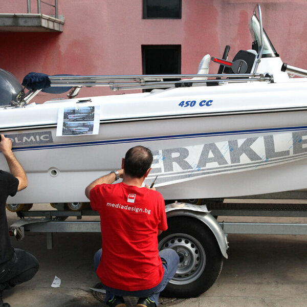 Wrapping a motorboat with advertising graphics performed by Media Design Advertising Agency