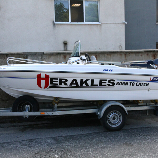 Wrapping a motorboat with advertising graphics for Vest Company