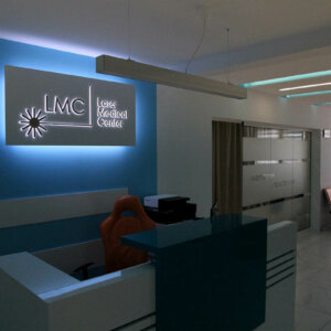 Illuminated sign with backlit embedded letters for LMC