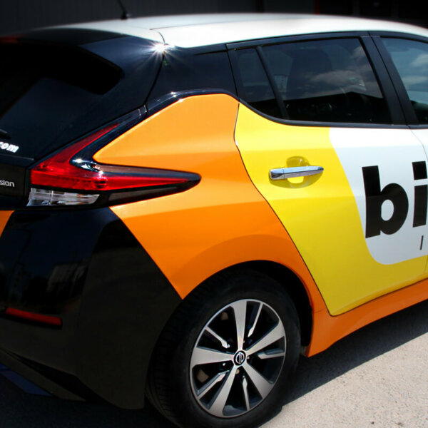 Car wrapping company car with advertising graphics Bilda INVEST Branding a company car with advertising graphics - Bilda INVEST