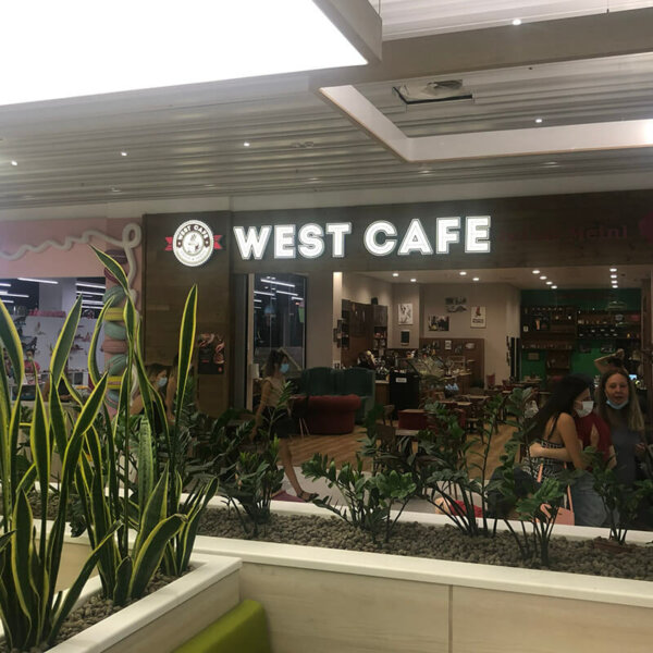 Illuminated channel letters and logo for West Café in Mall Plaza, Plovdiv Illuminated channel letters and logo for West Café in Mall Plaza