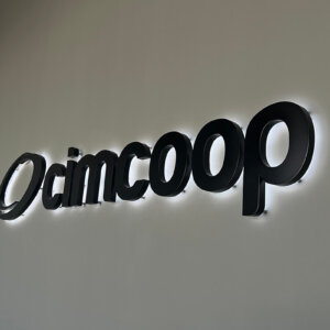 Illuminated back-lit interior channel letters and logo for Cimcoop