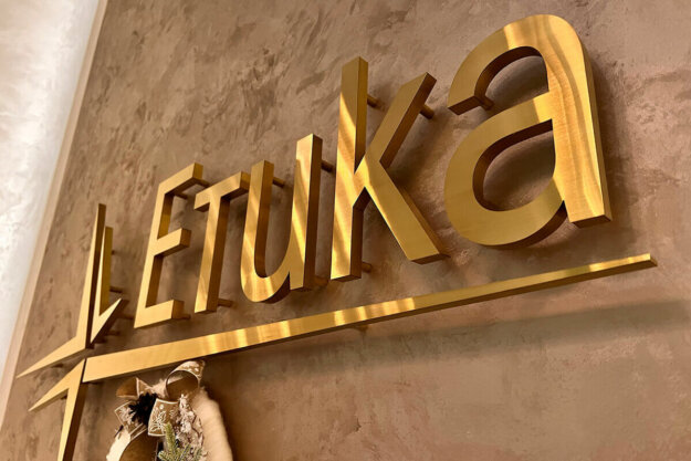 Interior golden stainless steel channel letters and logo for Medical Center Etika