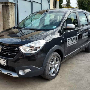 Black car of Stamh company wrapped with silver metallic film Black car of Stamh company wrapped with silver metallic film