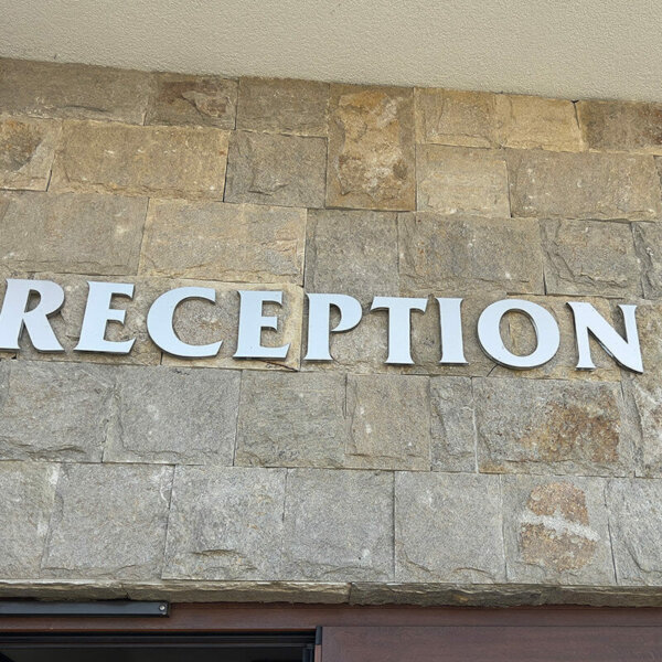 Embossed letters made of plexiglass and inox – Reception Embossed letters made of plexiglass and inox - Reception