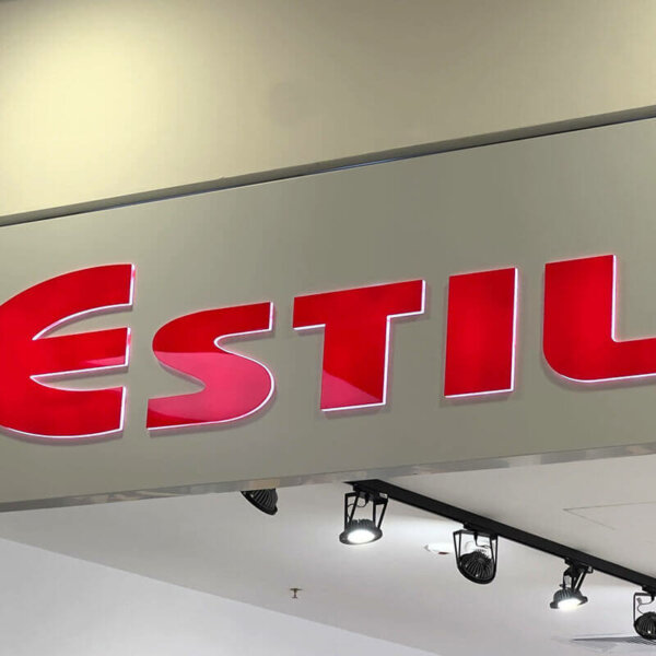 Embossed letters embedded in an composite panel sign for Estil Embossed letters embedded in an composite panel sign for Estil