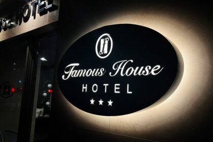 Illuminated sign for Famous House hotel