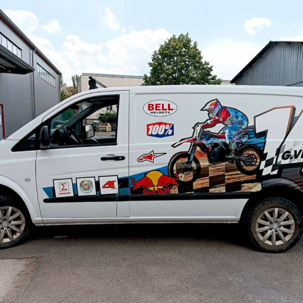 Bus branding with an advertisement of a motocross racer Bus branding with an advertisement of a motocross racer