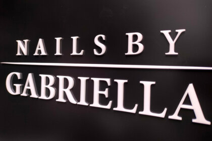 Fine white plexiglass letters on an etalbond base