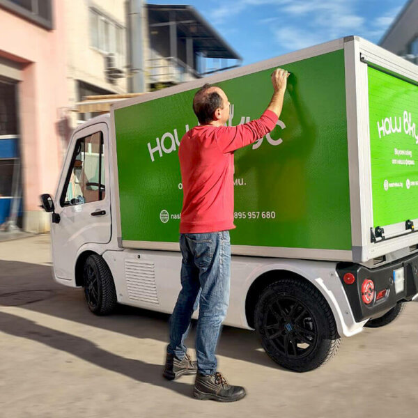Electric truck branding with advertising graphics Electric truck branding with advertising graphics