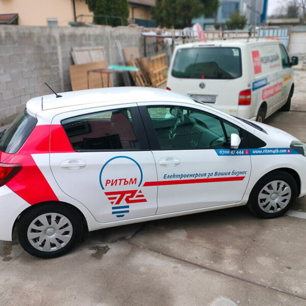 Covering company cars of an energy company with vinyl graphics lettering Covering company cars of an energy company with vinyl graphics lettering