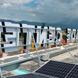 Sustainable illuminated channel letters on the roof of Factor Trade Center Sustainable illuminated channel letters on the roof of Factor Trade Center