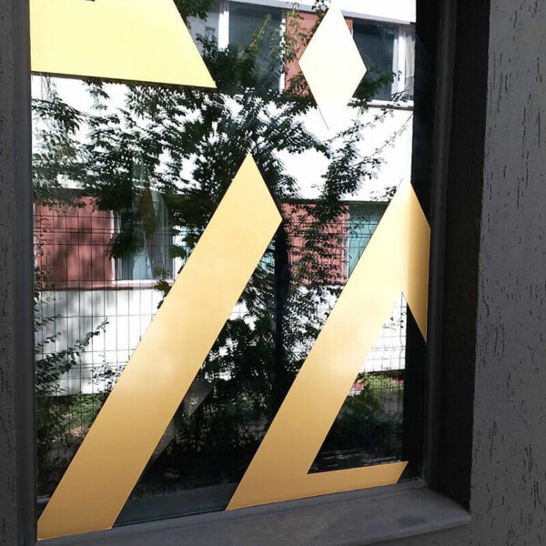 Window film wrap with Al Amar advertisement