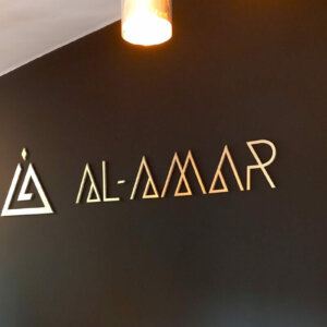 Embossed letters on a wall in an office