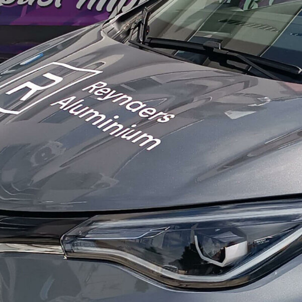 Vehicle wrap lettering on a car hood Vehicle wrap lettering on a car hood