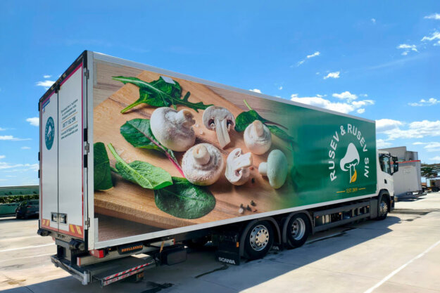 Truck wrapping with advertising graphics